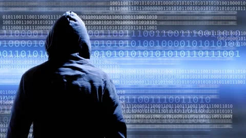 Hacker from behind and moving binary digits Stock Footage 134888505