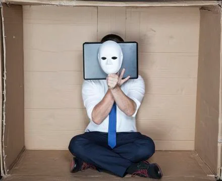 Hacker behind computer and mask Stock Photos
