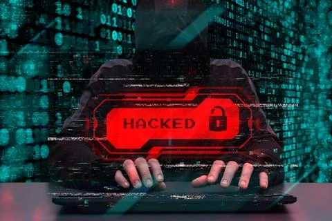 Hacker behind a computer with a red warning hacked. Concept of cybersecurit.. Stock Photos