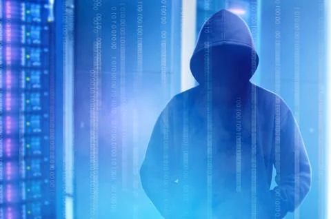 Hacker in black hoodie standing with binary code on virtual screen Stock Photos