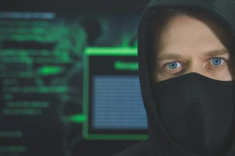 Hacker in black mask. Hacking and internet security concept. 写真素材