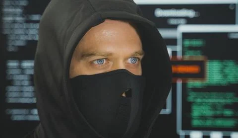 Hacker in black mask. Hacking and internet security concept. 写真素材