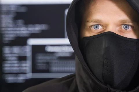 Hacker in black mask. Hacking and internet security concept. 写真素材