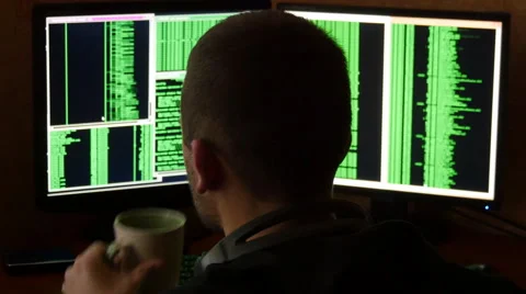 Hacker breaking code and drinking from the cup at your desk. Stock Footage 63088645