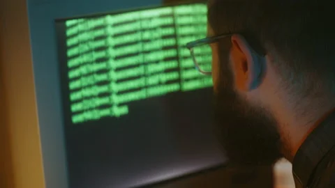 Hacker breaking into computer, typing code on screen, 90s, retrofuturistic Stock Footage 213990070