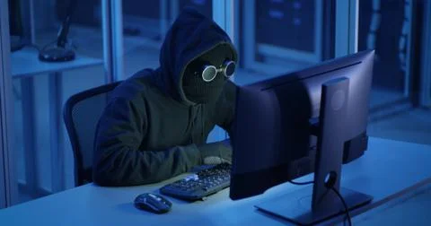 Hacker breaking into a data center Stock Photos