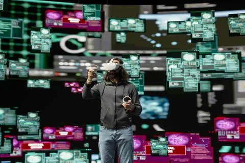 Hacker bypasses network security and engages in cyber crime with vr headset Stock Photos