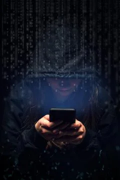 Hacker with cellphone. Stock Photos