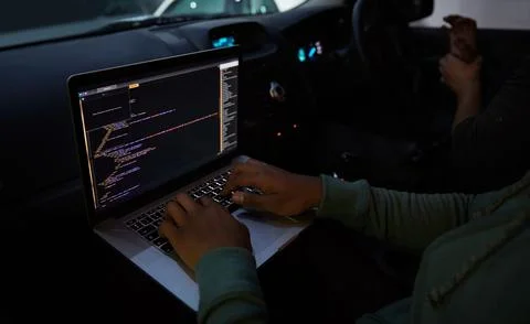 Hacker, code and laptop with person in car for ransomware, cyber security and Fotos Stock
