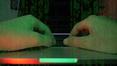 Hacker is coding and programming virus security system on screen laptop in dark Stock Footage 141698394