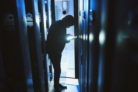 Hacker, coding and tablet in server room at night for malware, cyberattack .. Stock-Fotos