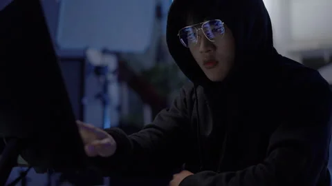 Hacker coding cyber attack and data breach using desktop Stock Footage 313824964