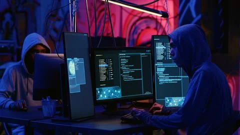 Hacker colleagues deploy malware Foto stock