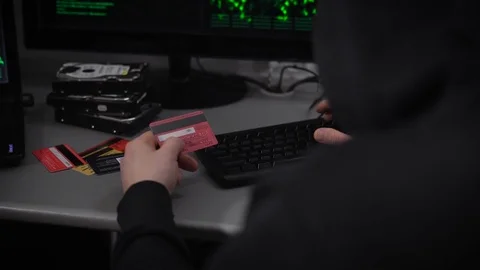 Hacker Company. A hacker is preparing for breaking financial accounts. A man at Vídeos de archivo 72424961