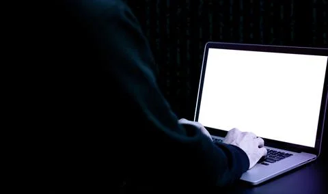 Hacker computer cyber security. Digital laptop in hacker man hand isolated on Stock Photos
