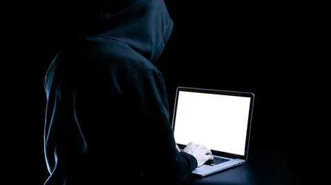 Hacker computer cyber security. Digital laptop in hacker man hand isolated on Foto stock