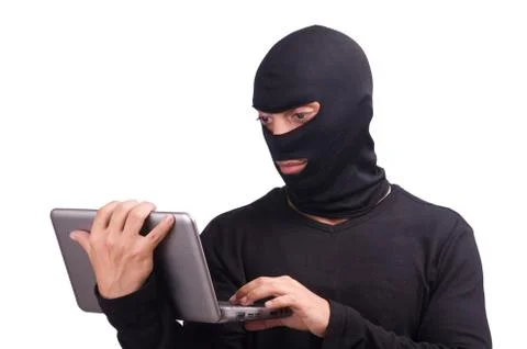 Hacker with computer wearing balaclava Stockfoto's