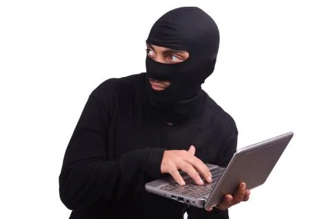 Hacker with computer wearing balaclava Stockfoto's