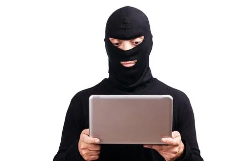 Hacker with computer wearing balaclava Stockfoto's