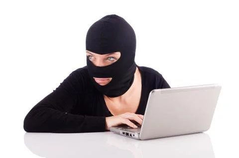 Hacker with computer wearing balaclava Stockfoto's
