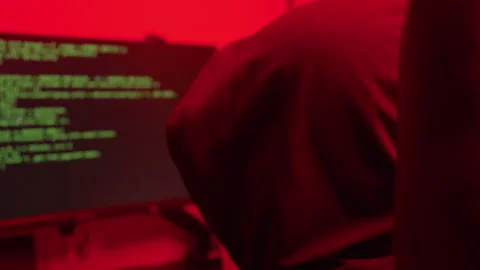 Hacker cracking code, over the shoulder view of the monitor Stock Footage 235762363