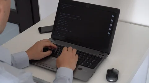 Hacker creating an aritificial intelligence software on a laptop 스톡 동영상 118302162