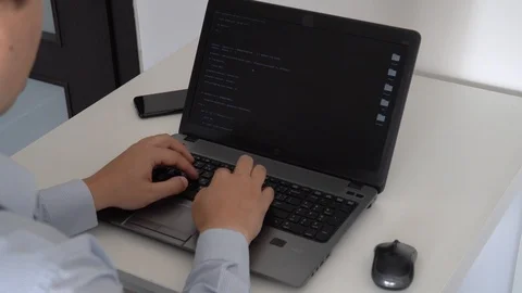 Hacker creating an aritificial intelligence software on a laptop 스톡 동영상 118302369