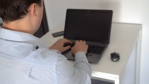 Hacker creating an aritificial intelligence software on a laptop 스톡 동영상 118308902