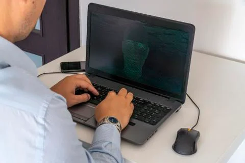 Hacker creating an artificial intelligence software program Stock Photos