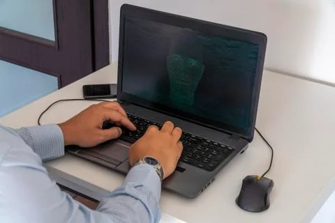 Hacker creating an artificial intelligence software program Stock Photos