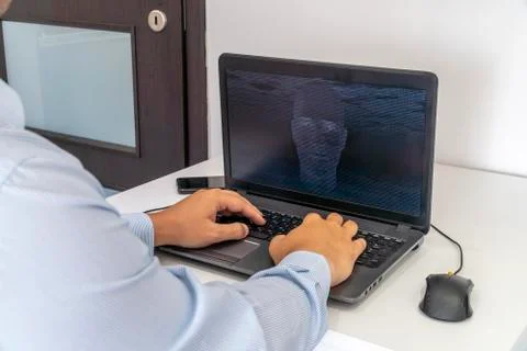 Hacker creating an artificial intelligence software program Stock Photos