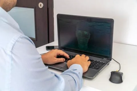 Hacker creating an artificial intelligence software program Stock Photos