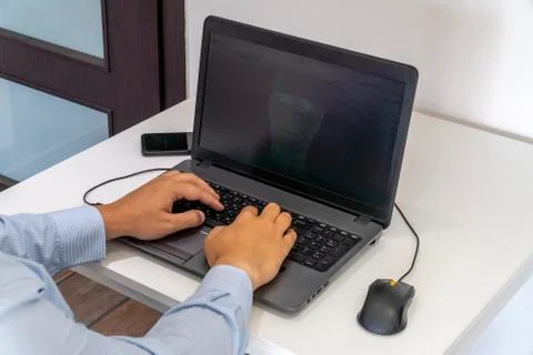 Hacker creating an artificial intelligence software program Stock Photos