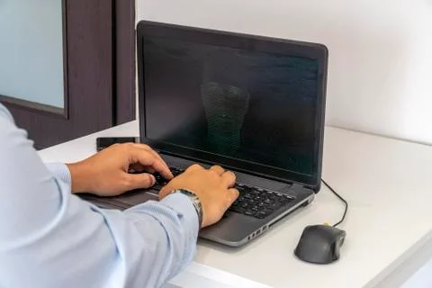 Hacker creating an artificial intelligence software program Stock Photos