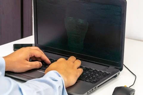 Hacker creating an artificial intelligence software program Stock Photos