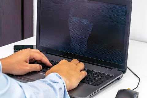 Hacker creating an artificial intelligence software program Stock Photos