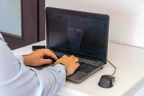 Hacker creating an artificial intelligence software program Stock Photos