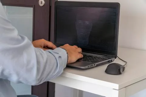 Hacker creating an artificial intelligence software program Stock Photos