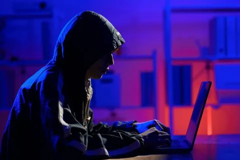 Hacker cyberattack representing data breach and cybersecurity threat in digit Stock Photos