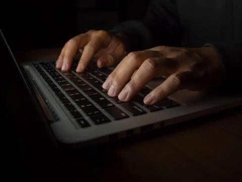 Hacker in dark background concept Stock Photos