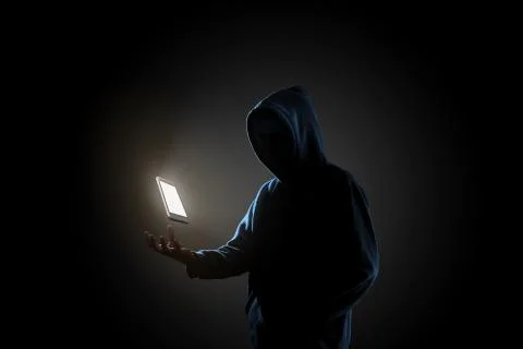 Hacker in dark background concept Stock Photos