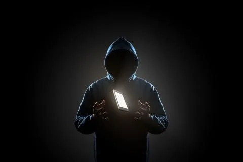 Hacker in dark background concept Stock Photos