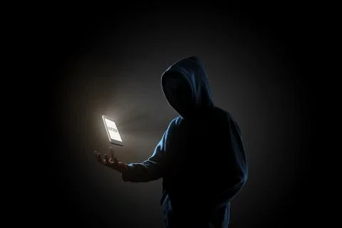 Hacker in dark background concept Stock Photos