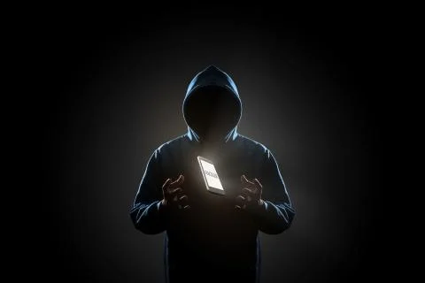 Hacker in dark background concept Stock Photos