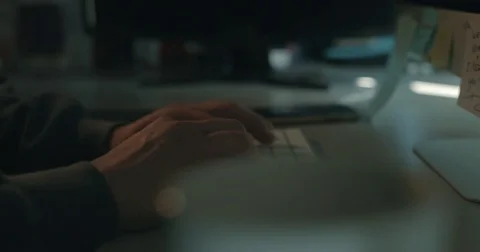 Hacker in dark office typing code 库存影片 78037704