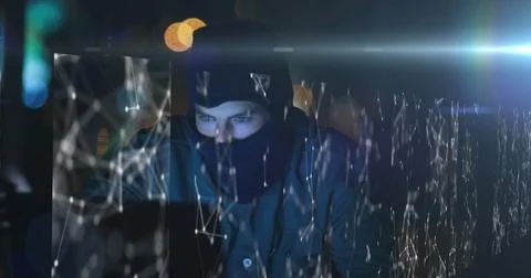 Hacker in dark room using laptop with digital network overlay, focused on screen Stock Illustration