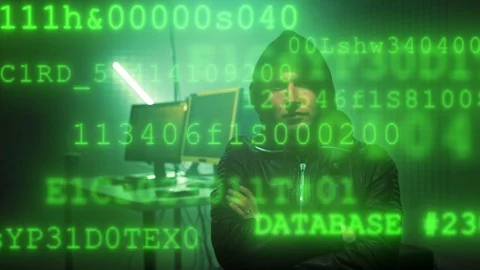 Hacker in dark room writing code or using computer virus program for cyber Stock Footage 120666258