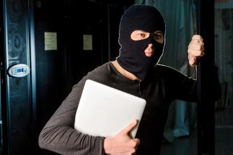 Hacker in a datacenter Stock Photos