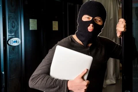 Hacker in a datacenter Stock Photos