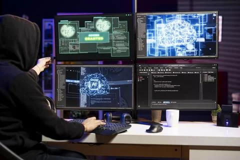 Hacker doing ransomware attacks using AI machine learning Stock-Fotos